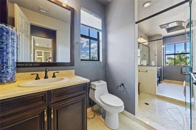 a view of kitchen with stainless steel appliances refrigerator and cabinets