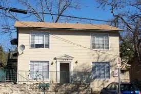 a front view of a house with parking