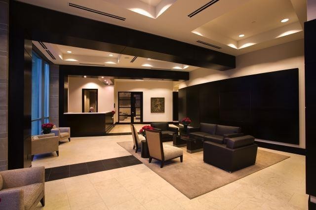 1920 Adelicia Street, Unit 404 Nashville, TN 37212 - Photo 13 of 15 a living room with furniture and a flat screen tv