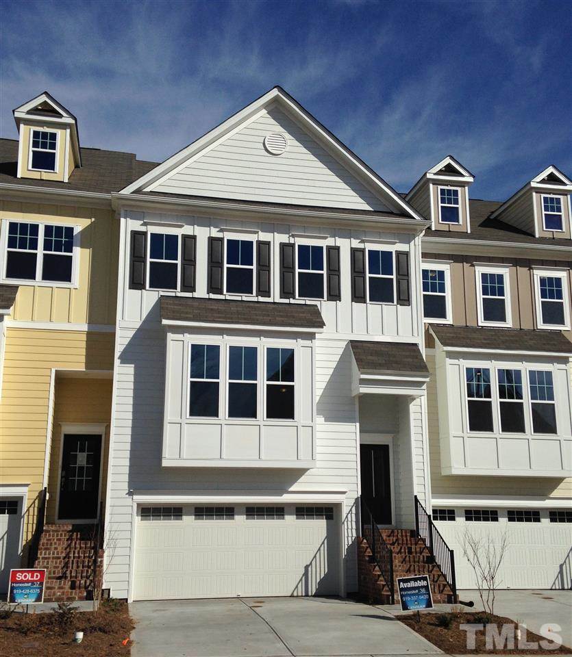 632 Edgewater Ridge Court Apex, NC 27523 - Photo 1 of 21 a front view of a building with many windows