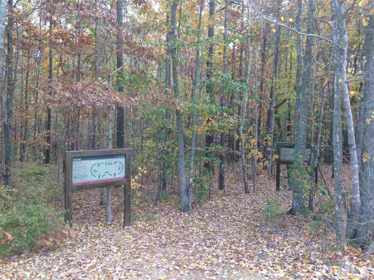 632 Edgewater Ridge Court Apex, NC 27523 - Photo 15 of 21 a view of a pathway with a bench
