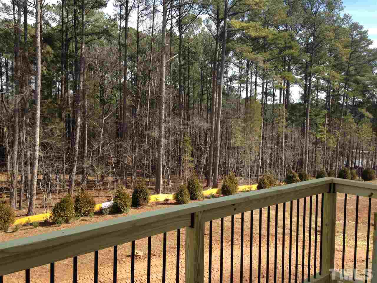 632 Edgewater Ridge Court Apex, NC 27523 - Photo 9 of 21 a view of a balcony with trees