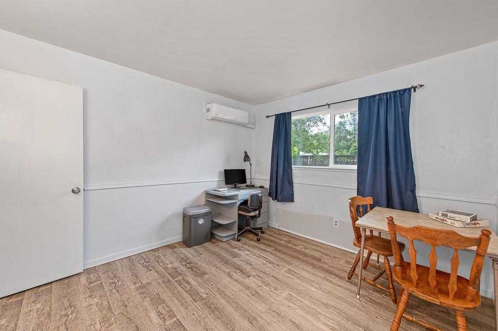 6689 Rhodes Avenue Placerville, CA 95667 - Photo 27 of 60 a reading room with wooden floor and furniture