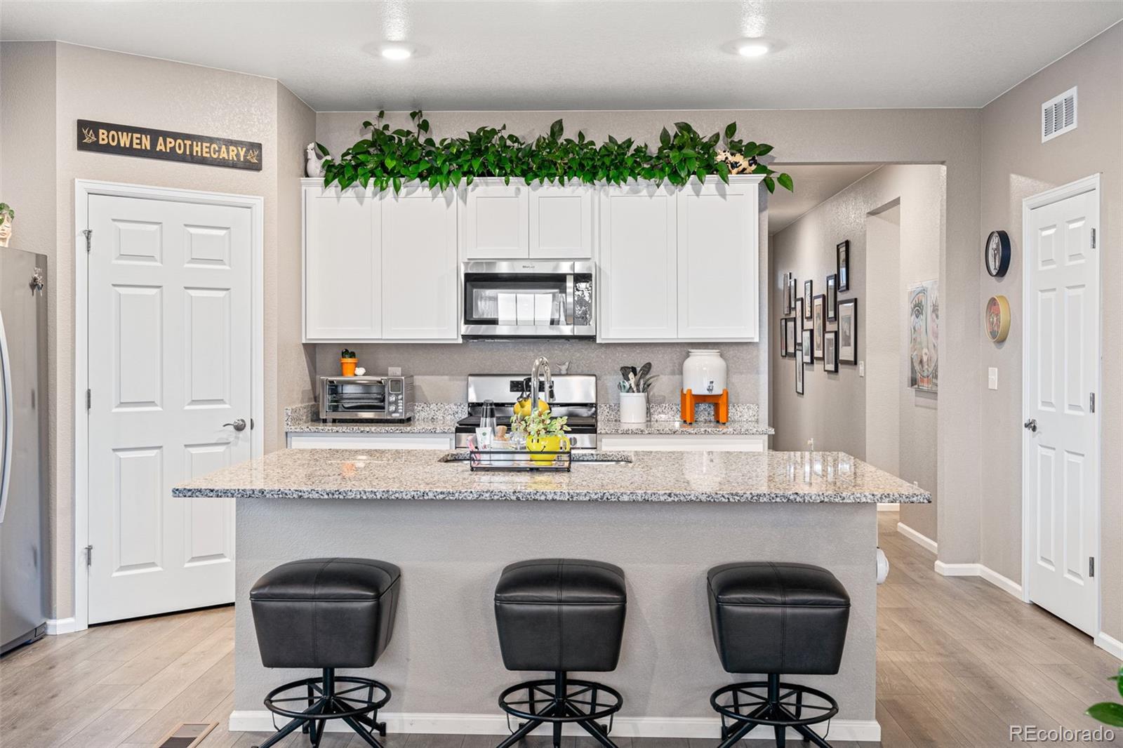 10054 Carefree Street Firestone, CO 80504 - Photo 18 of 50 a kitchen with a refrigerator and a sink