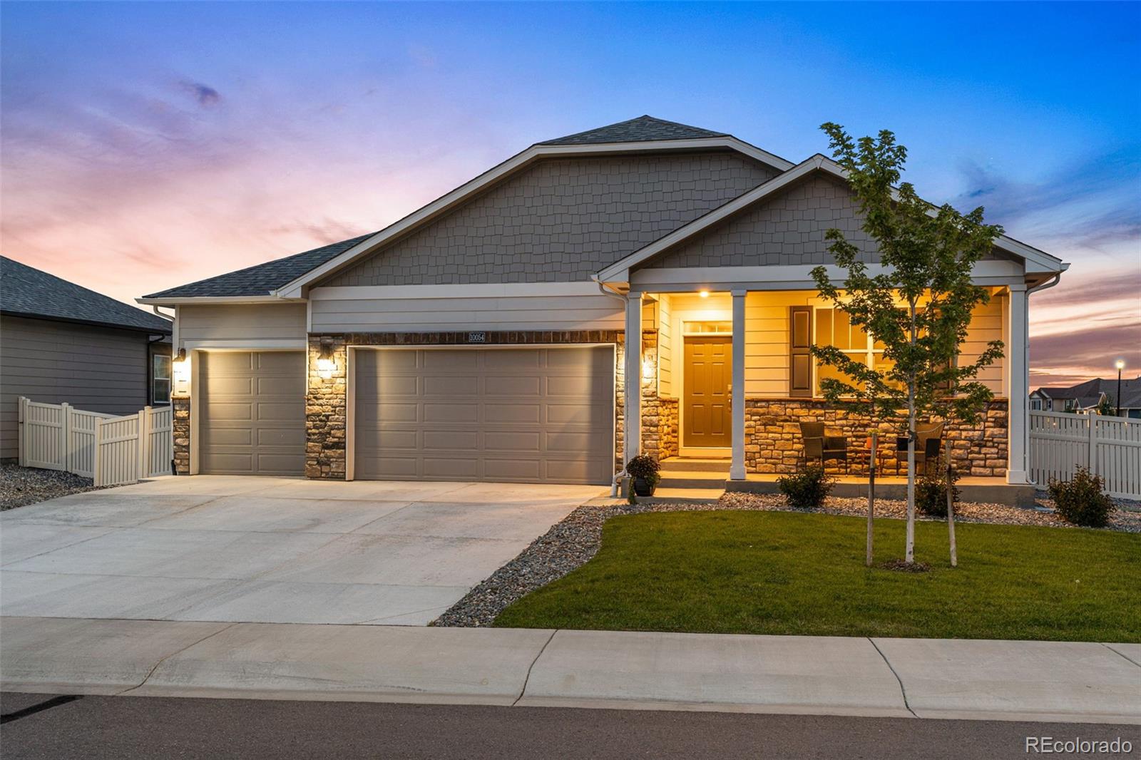 10054 Carefree Street Firestone, CO 80504 - Photo 2 of 50 a view of a house with a yard