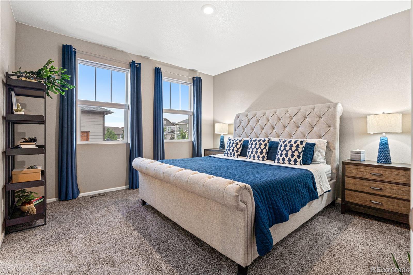 10054 Carefree Street Firestone, CO 80504 - Photo 23 of 50 a bedroom with a bed dresser and a window