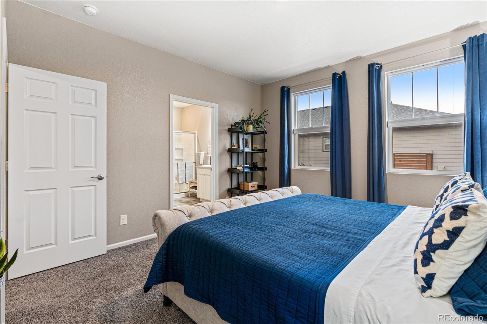 10054 Carefree Street Firestone, CO 80504 - Photo 25 of 50 a bedroom with a bed and a closet