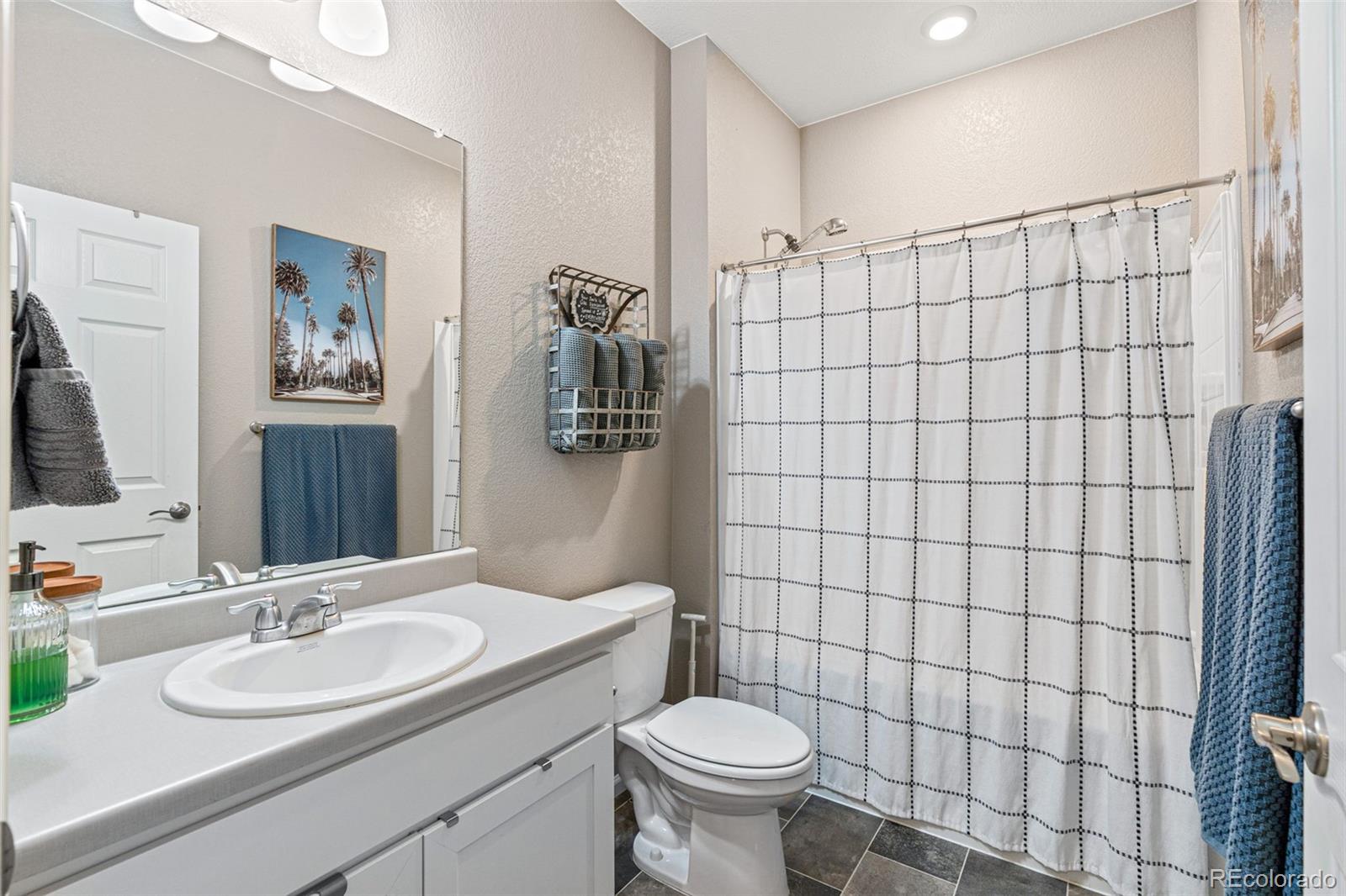 10054 Carefree Street Firestone, CO 80504 - Photo 36 of 50 a bathroom with a sink toilet and shower