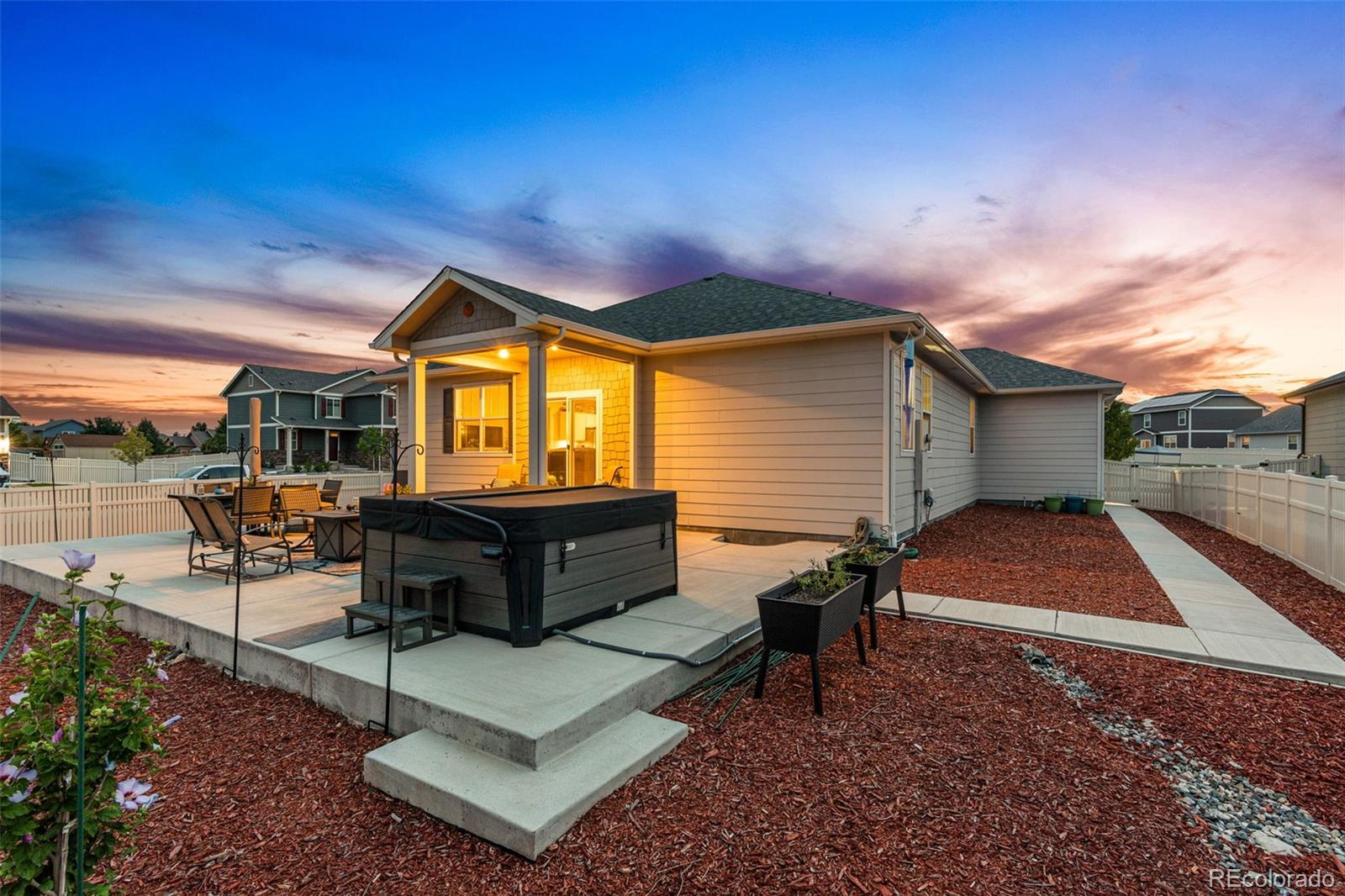 10054 Carefree Street Firestone, CO 80504 - Photo 39 of 50 a view of a porch with furniture and a yard
