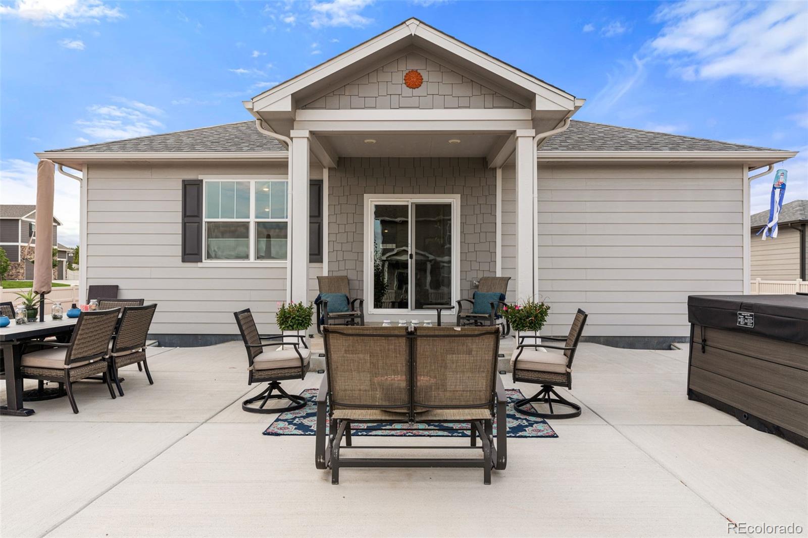 10054 Carefree Street Firestone, CO 80504 - Photo 43 of 50 a view of a house with patio and a yard