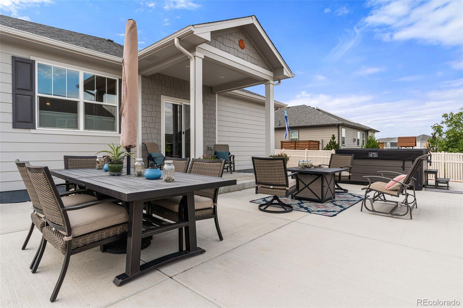 10054 Carefree Street Firestone, CO 80504 - Photo 45 of 50 a view of a dinning table and chairs in the patio