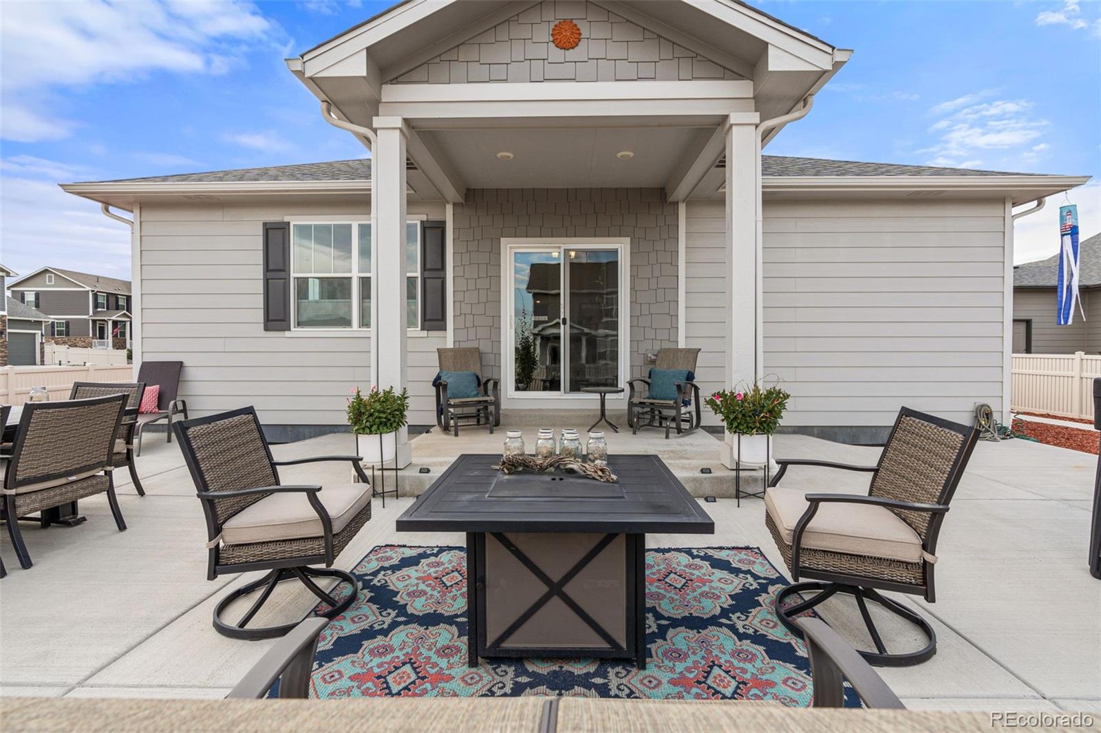 10054 Carefree Street Firestone, CO 80504 - Photo 46 of 50 a view of a patio with table and chairs and potted plants