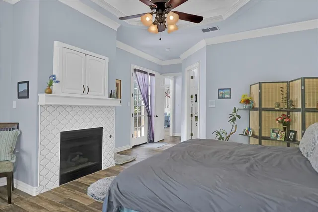 a bedroom with furniture and a fireplace
