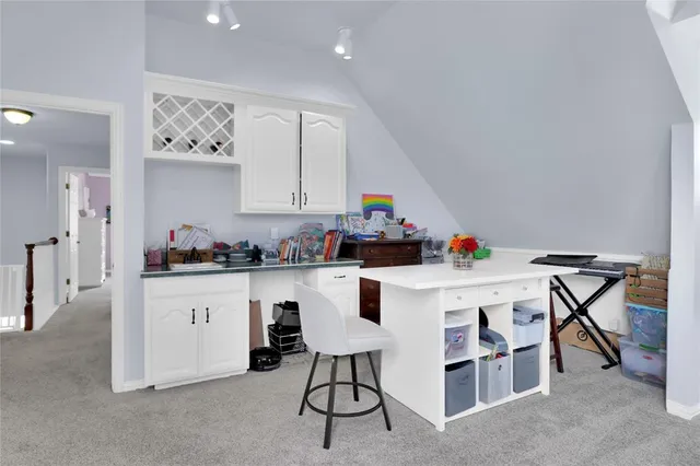 a living room with furniture a chandelier and a window