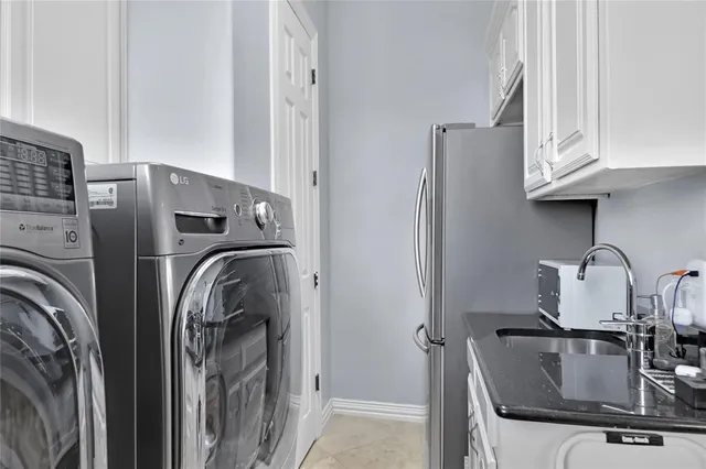 a front view of a house with a yard table and chairs