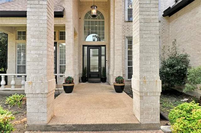 a view of a building with potted plants