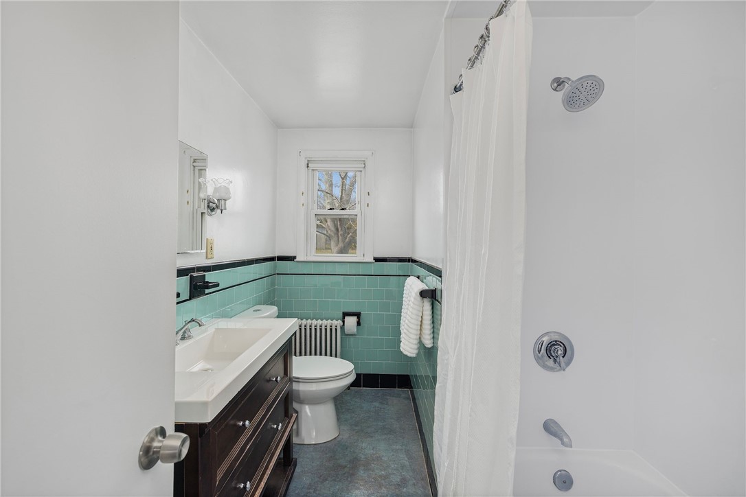 7 Casey Drive Middletown, RI 02842 - Photo 14 of 47 With updated tub/shower surround and new vanity.