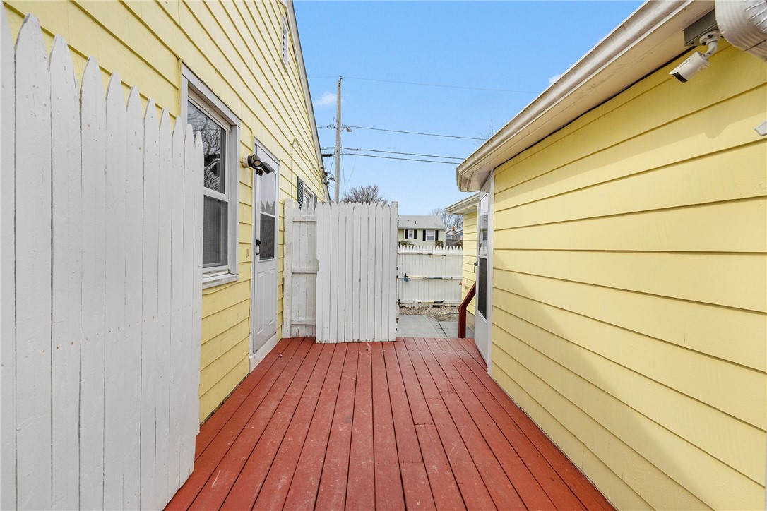 7 Casey Drive Middletown, RI 02842 - Photo 26 of 47 Connecting deck to converted garage.