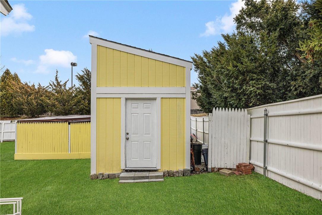 7 Casey Drive Middletown, RI 02842 - Photo 41 of 47 15 x 15 x 10 anchored to the ground shed. Grass has been virtually enhanced.