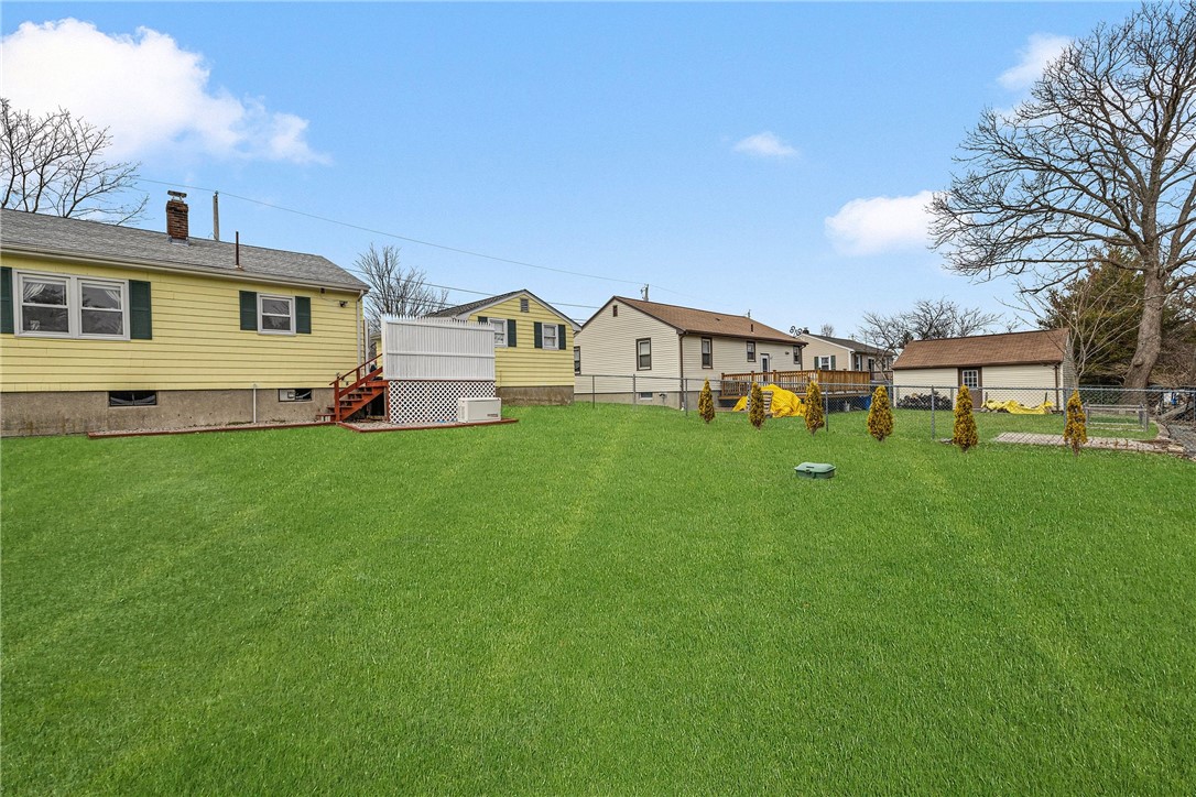 7 Casey Drive Middletown, RI 02842 - Photo 43 of 47 Whole house propane generator. Grass has been virtually enhanced.