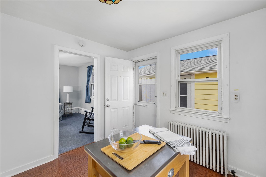 7 Casey Drive Middletown, RI 02842 - Photo 10 of 47 Side entryway to deck, converted garage, and backyard.
