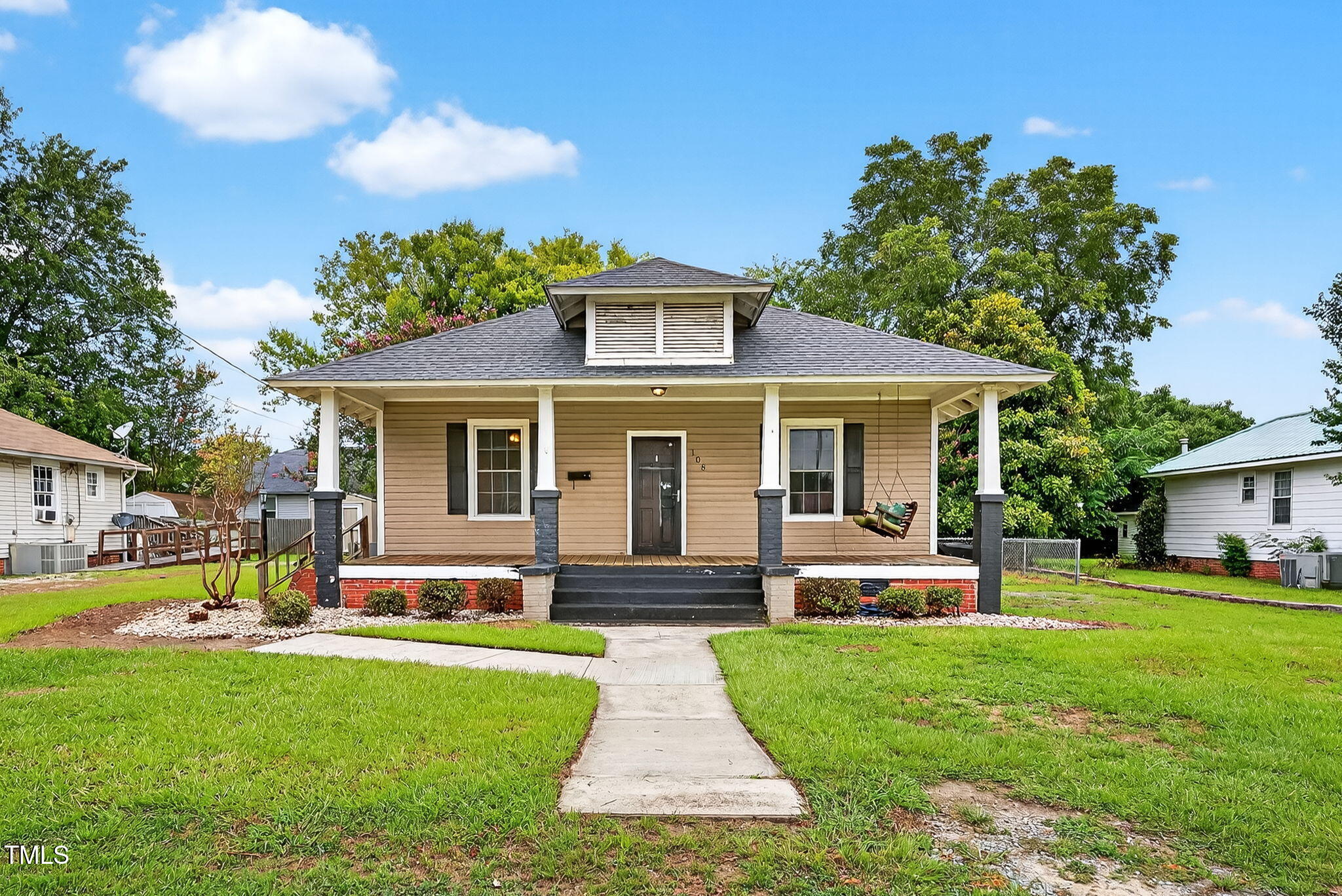 108 West C Street Erwin, NC 28339 - Photo 1 of 37 a front view of house with yard and green space