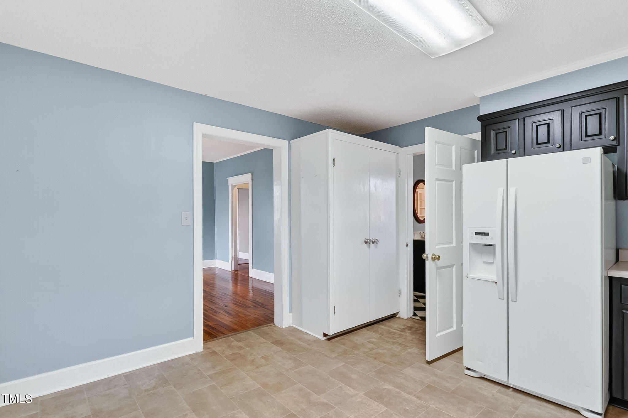 108 West C Street Erwin, NC 28339 - Photo 17 of 37 a view of a hallway with closet and wooden floor