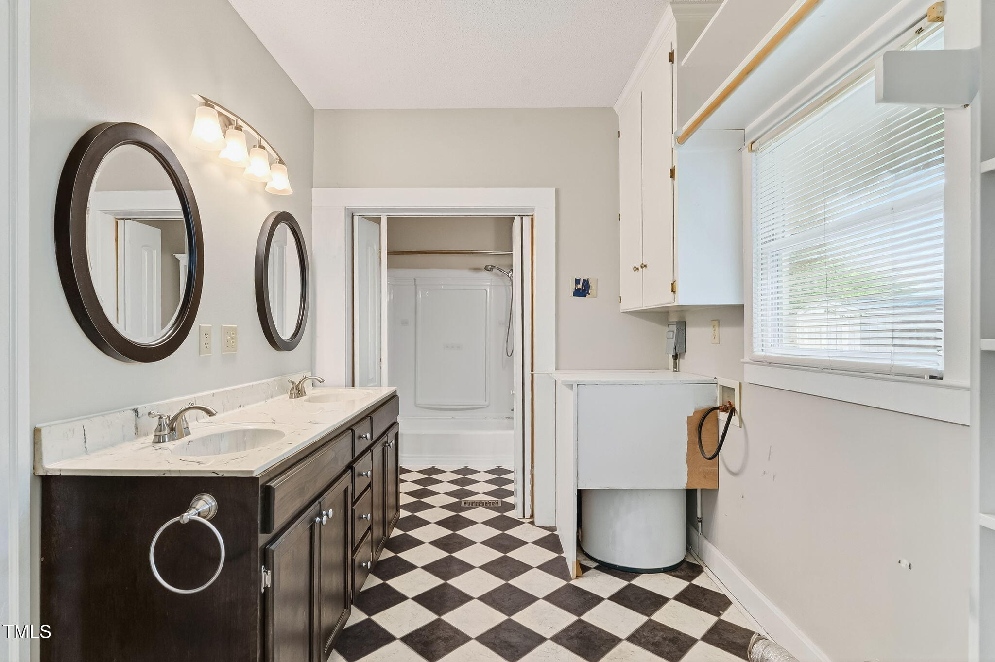 108 West C Street Erwin, NC 28339 - Photo 19 of 37 a bathroom with a sink toilet and a mirror