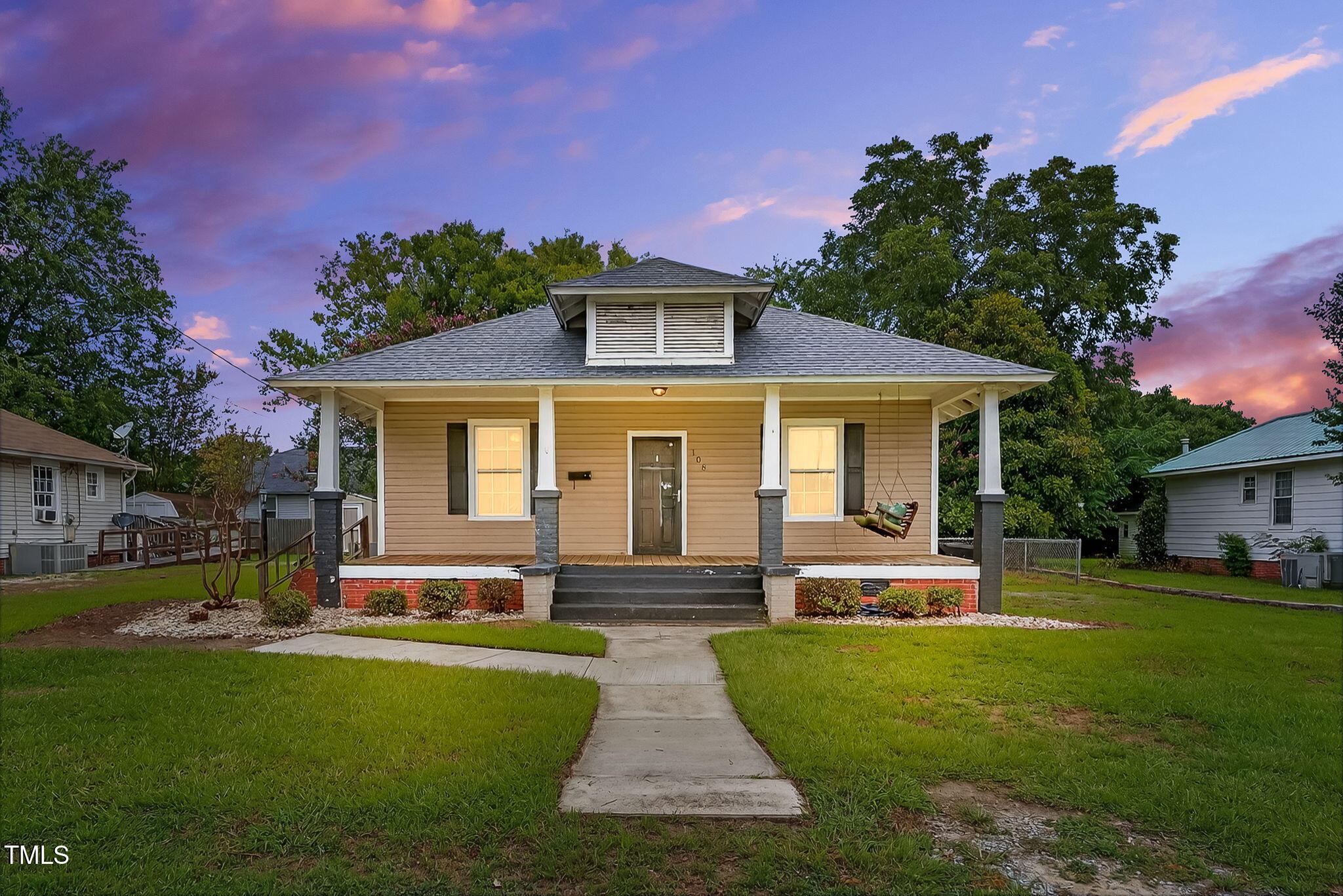 108 West C Street Erwin, NC 28339 - Photo 2 of 37 a front view of a house with a yard