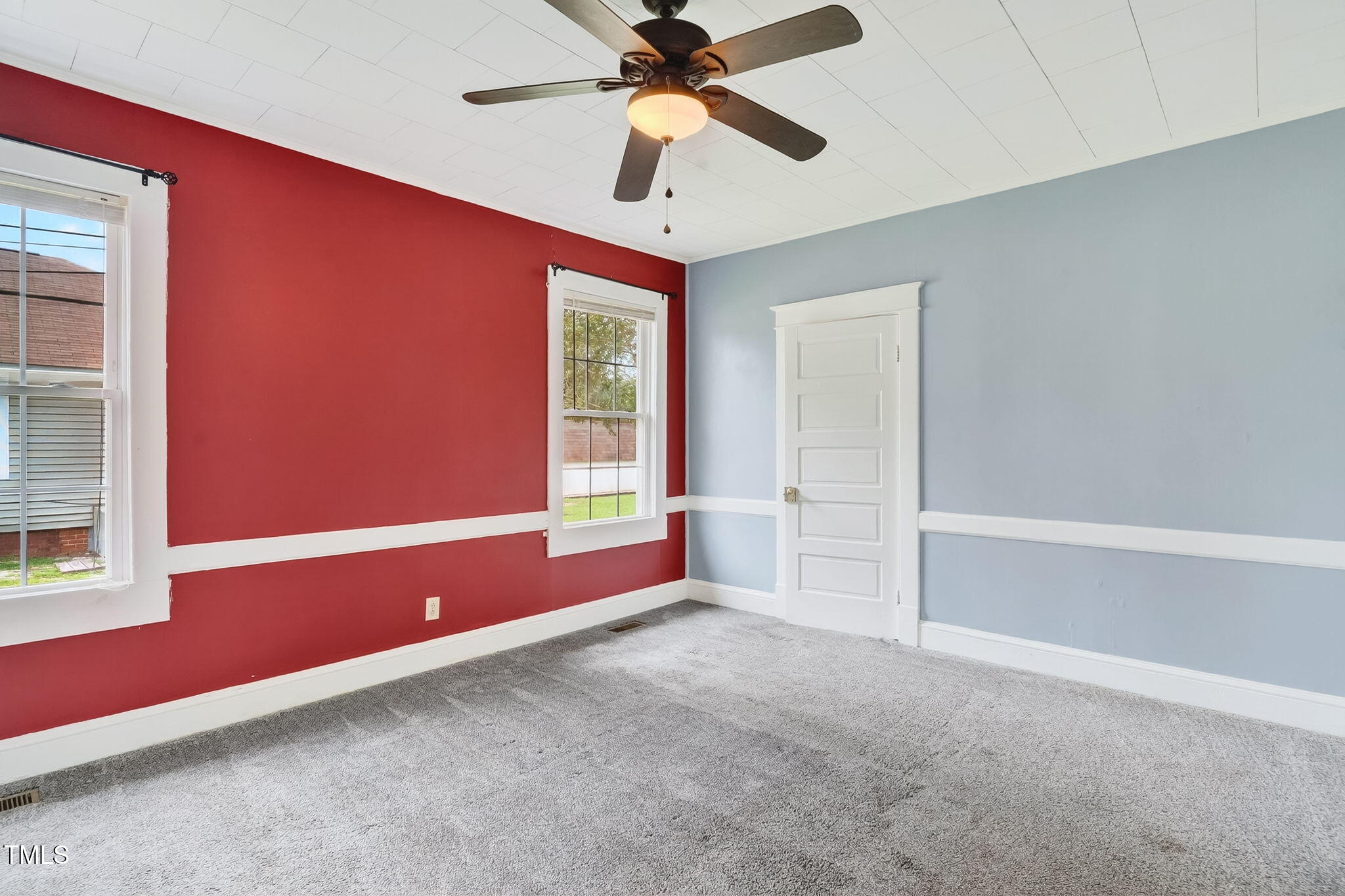 108 West C Street Erwin, NC 28339 - Photo 23 of 37 a room with window and a ceiling fan