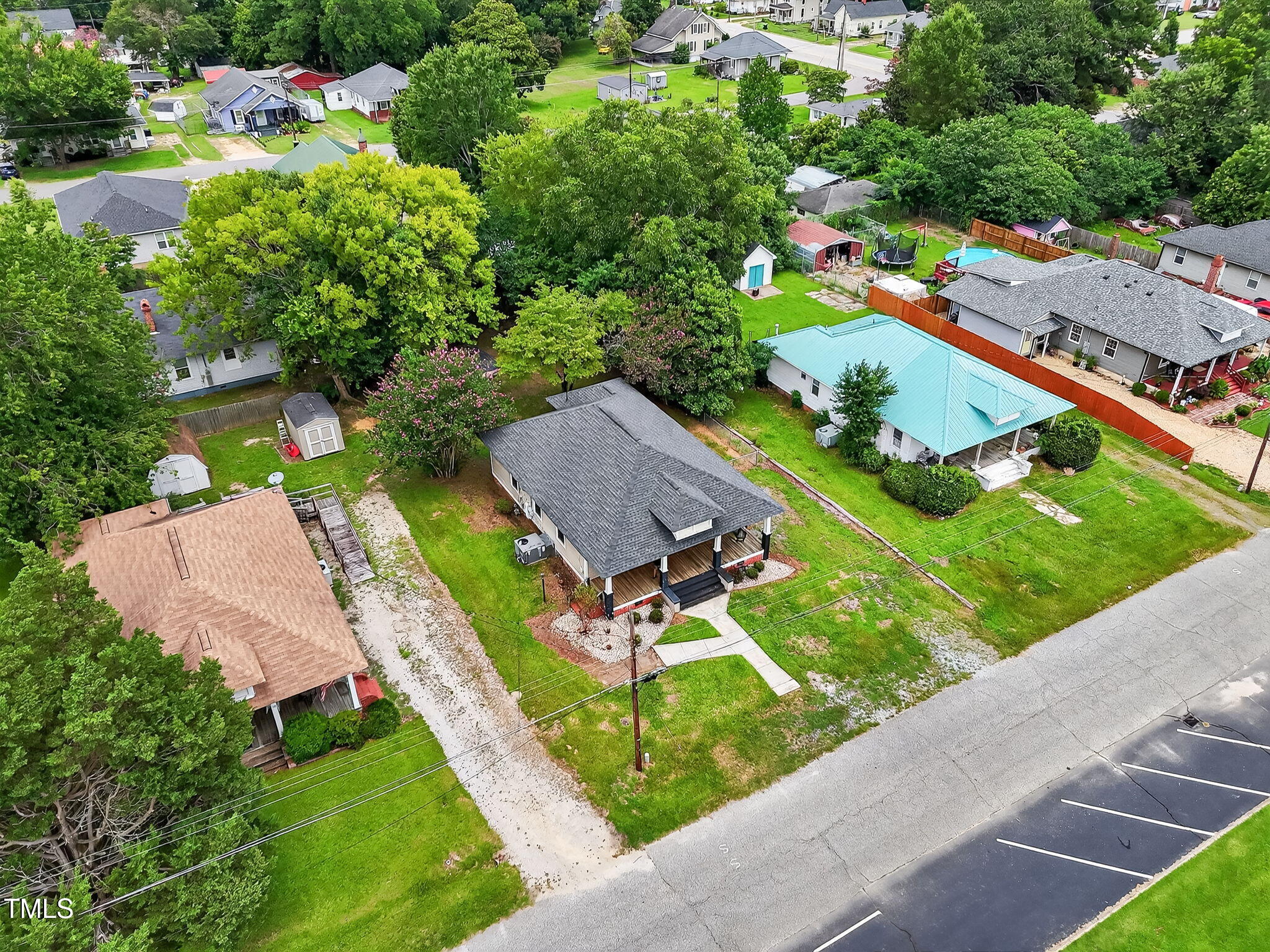 108 West C Street Erwin, NC 28339 - Photo 26 of 37 an aerial view of a house with a garden and swimming pool