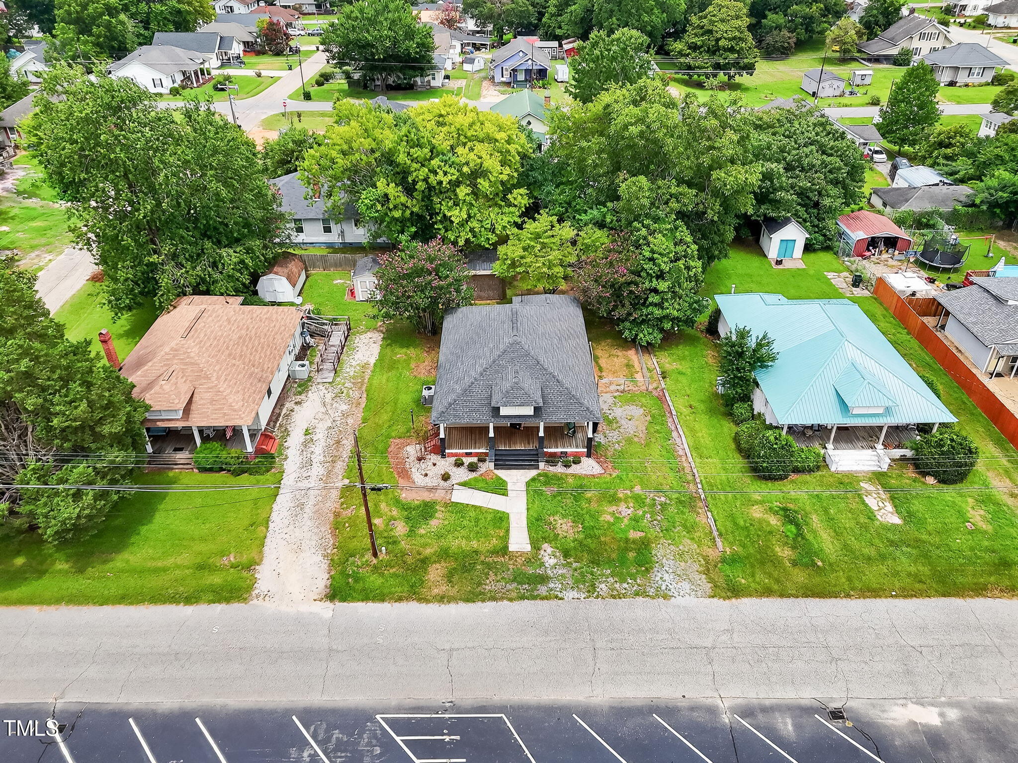 108 West C Street Erwin, NC 28339 - Photo 27 of 37 an aerial view of a house with a yard and lake view