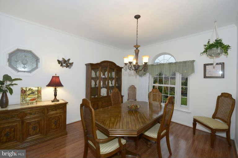 1408 Clearview Road Edgewood, MD 21040 - Photo 4 of 26 a view of a dining room with furniture wooden floor and a chandelier