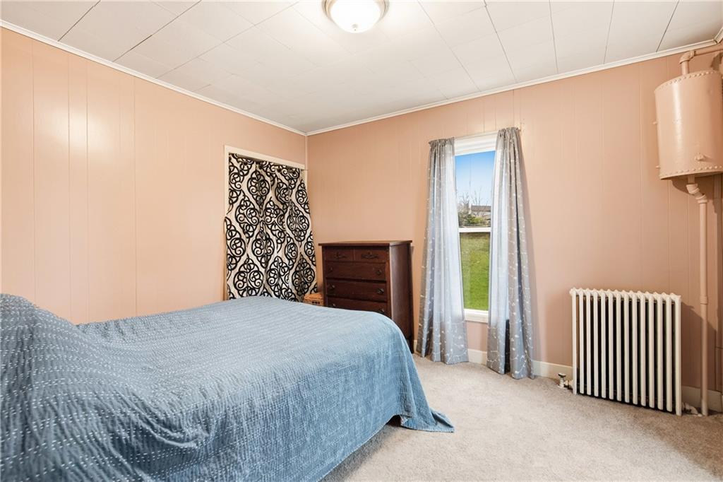 126 Welsh Hill Road Friedens, PA 15541 - Photo 13 of 31 a bedroom with a bed and a window