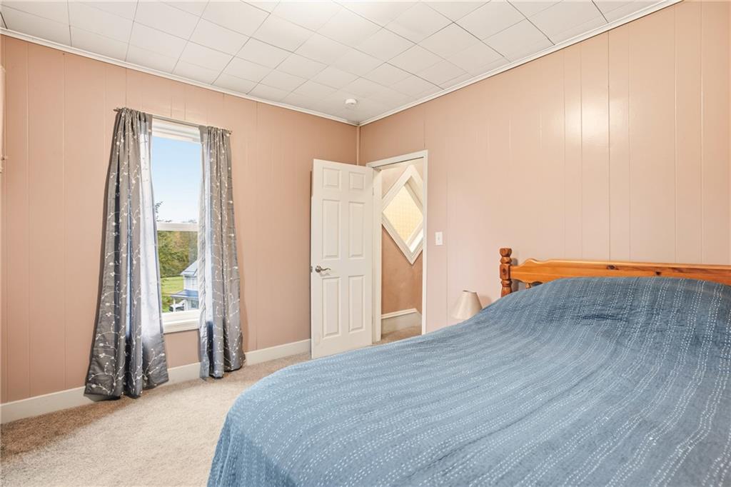 126 Welsh Hill Road Friedens, PA 15541 - Photo 14 of 31 a bedroom with a bed and a window
