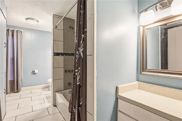 a bathroom with a sink and a shower