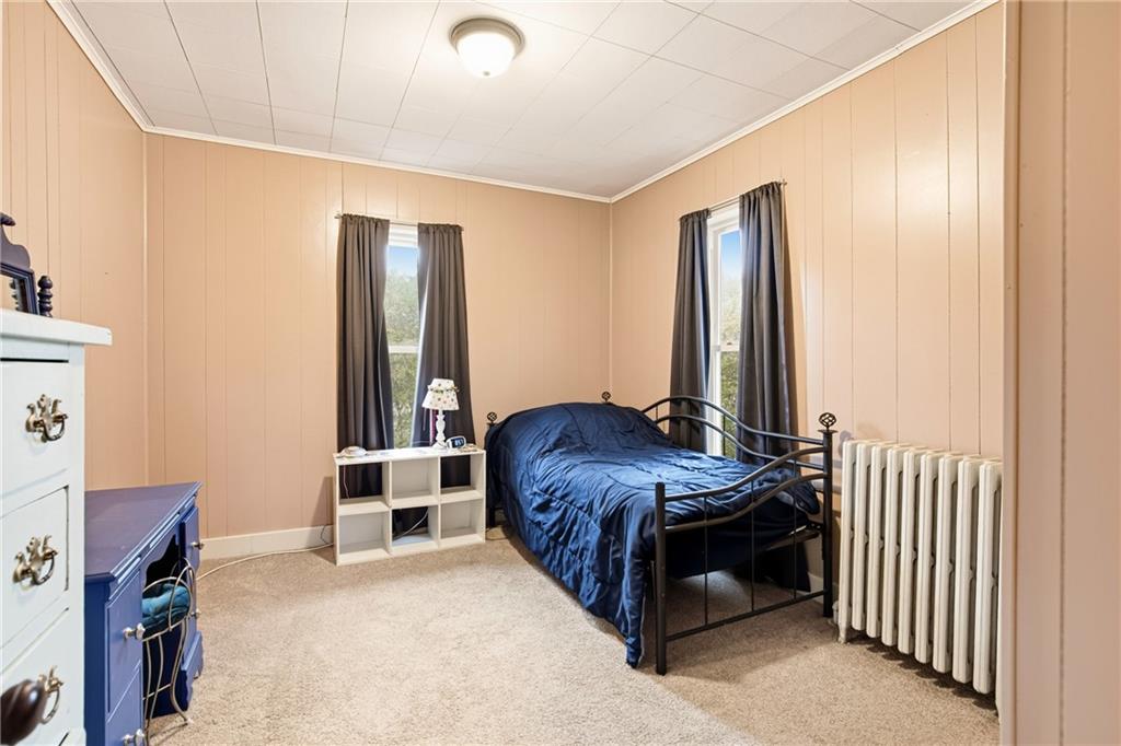 126 Welsh Hill Road Friedens, PA 15541 - Photo 17 of 31 a bedroom with a bed and a window