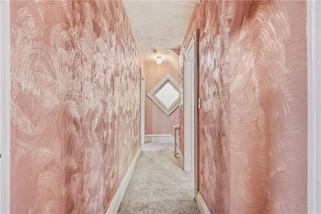 a view of a bathroom from a hallway