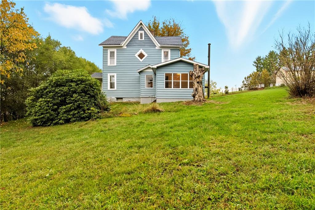 126 Welsh Hill Road Friedens, PA 15541 - Photo 25 of 31 a front view of a house with a yard