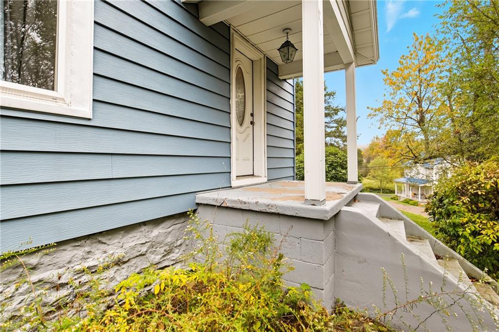 126 Welsh Hill Road Friedens, PA 15541 - Photo 28 of 31 a view of a house with a wooden bench