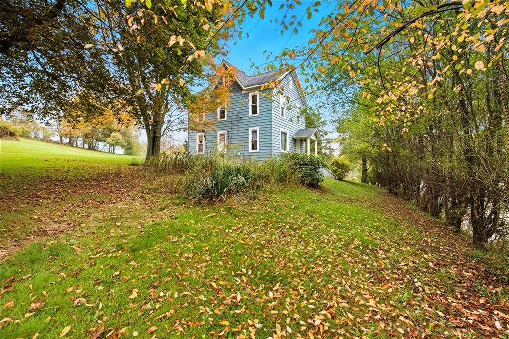 126 Welsh Hill Road Friedens, PA 15541 - Photo 30 of 31 a front view of a house with garden