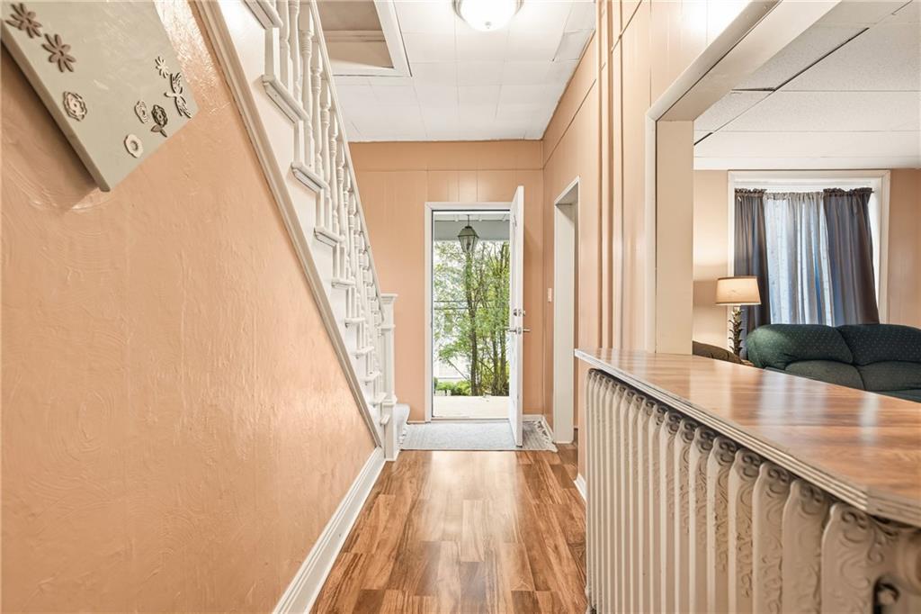 126 Welsh Hill Road Friedens, PA 15541 - Photo 8 of 31 a view of a hallway with wooden floor and staircase