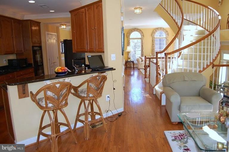 154 Rees Place Falls Church, VA 22046 - Photo 12 of 21 a living room with furniture a wooden floor and next to a window
