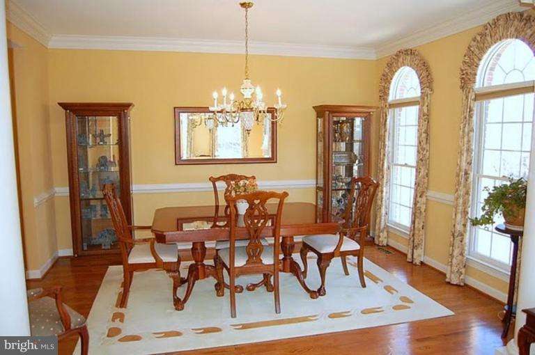 154 Rees Place Falls Church, VA 22046 - Photo 4 of 21 a view of a dining room with furniture window and wooden floor