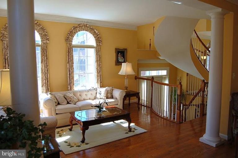 154 Rees Place Falls Church, VA 22046 - Photo 7 of 21 a living room with furniture and a large window