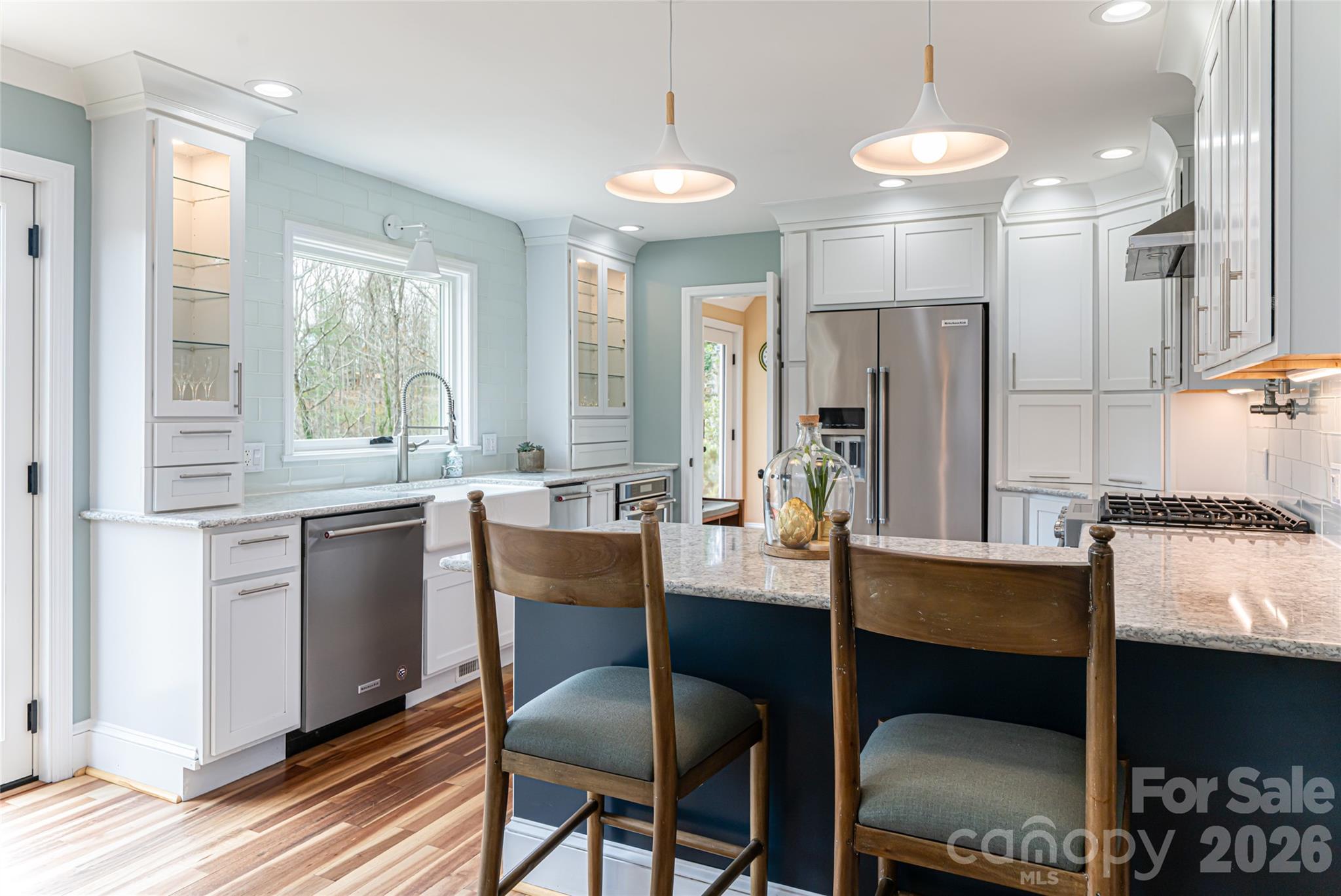 210 Wildflower Road Asheville, NC 28804 - Photo 14 of 46 a large kitchen with a table and chairs