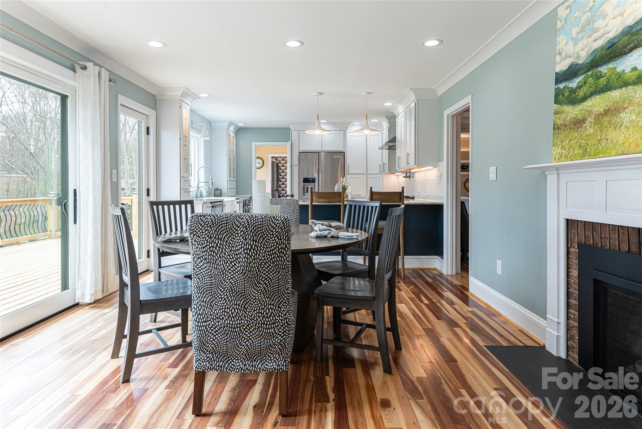 210 Wildflower Road Asheville, NC 28804 - Photo 16 of 46 a view of a dining room with furniture and wooden floor