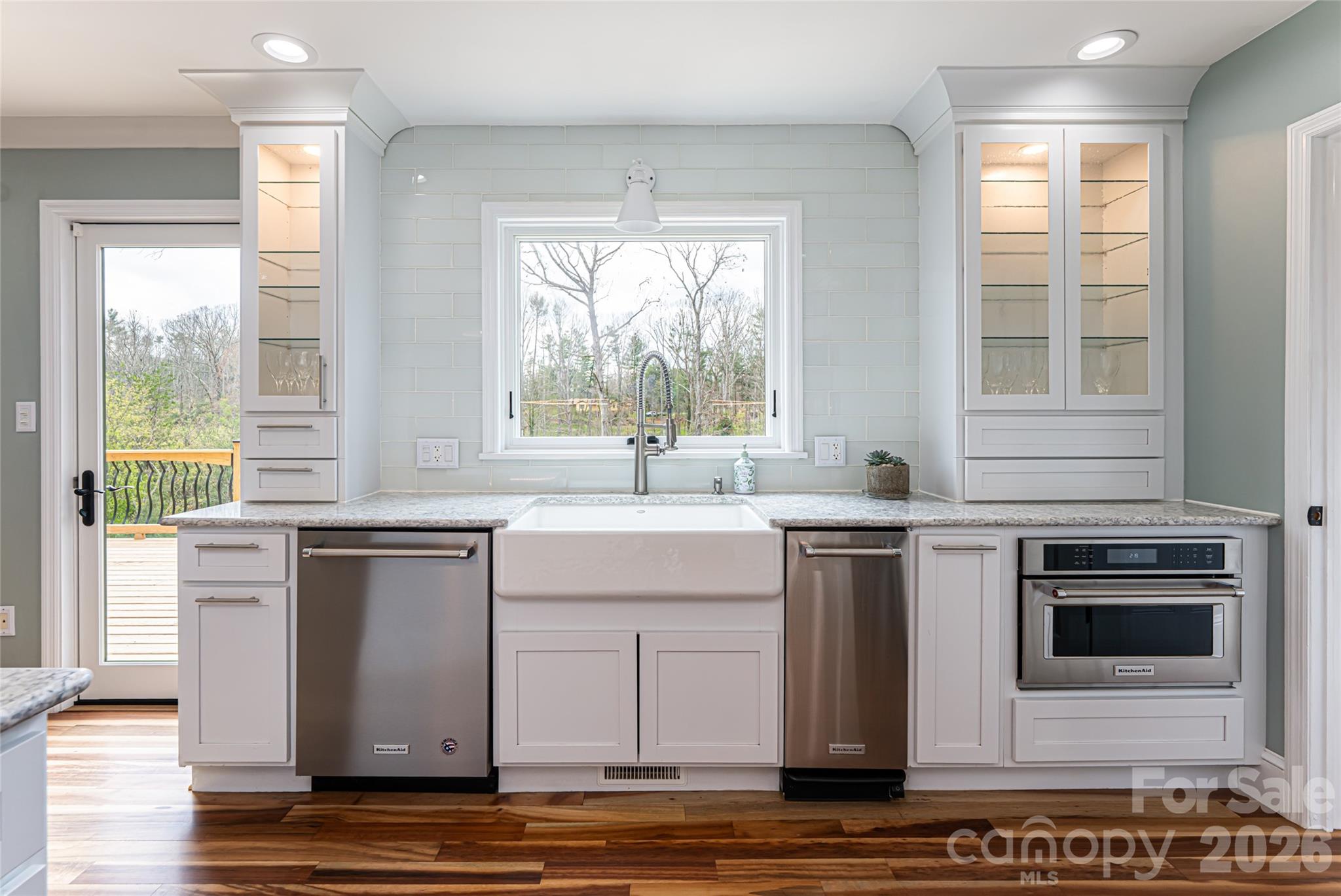 210 Wildflower Road Asheville, NC 28804 - Photo 20 of 46 a kitchen with stainless steel appliances granite countertop a stove a sink and a microwave