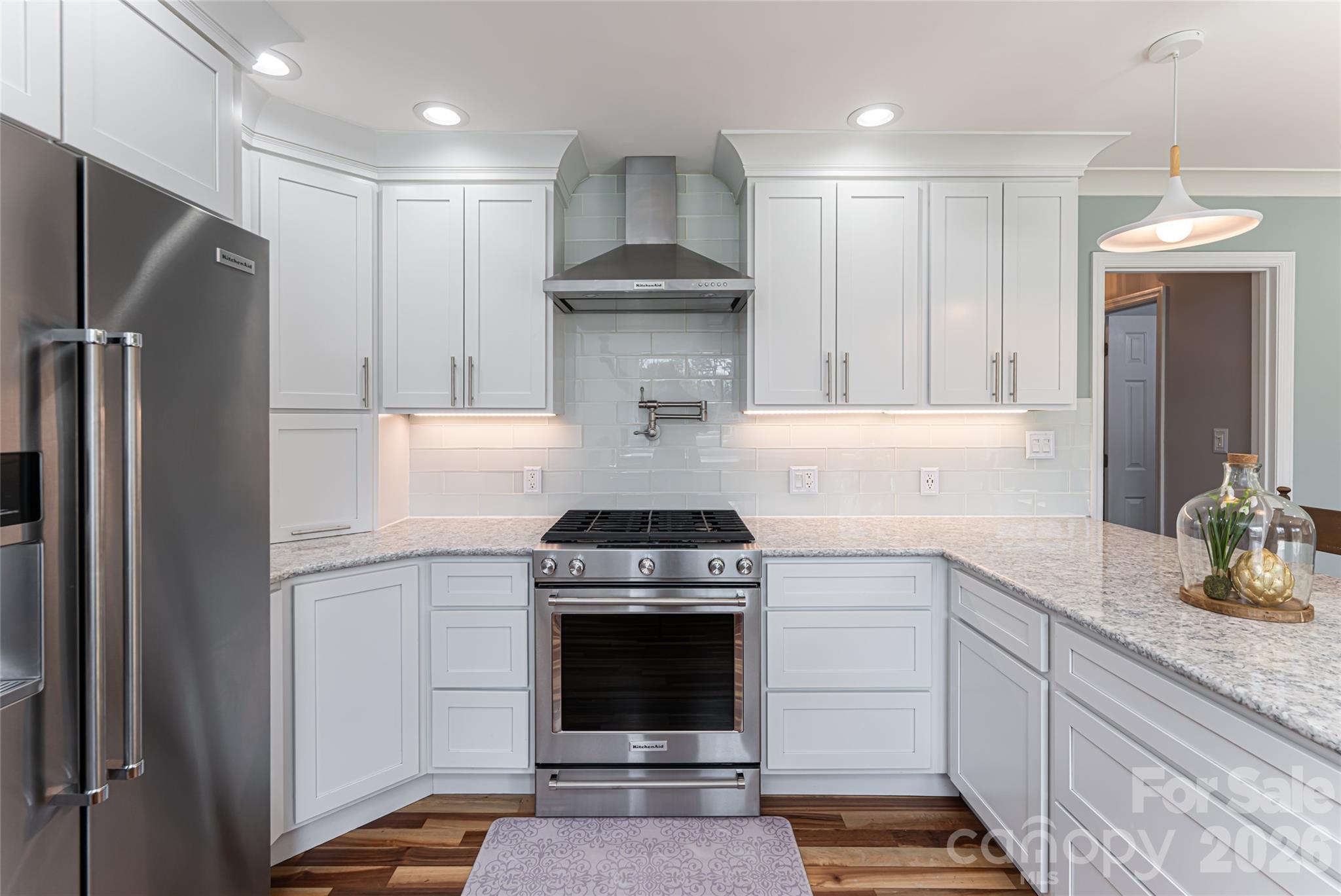 210 Wildflower Road Asheville, NC 28804 - Photo 21 of 46 a kitchen with a stove and refrigerator