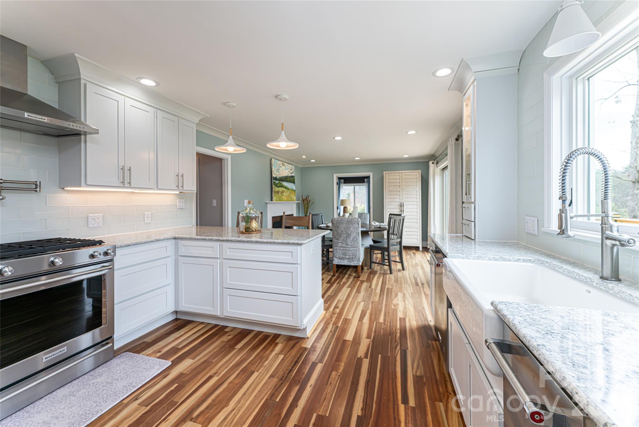 210 Wildflower Road Asheville, NC 28804 - Photo 23 of 46 a large kitchen with sink stove and cabinets